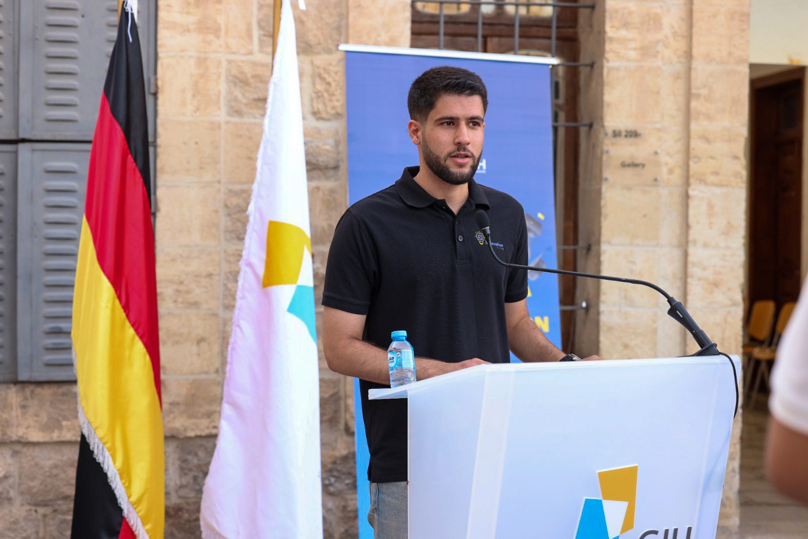 Hasan Abuzaid speaking at a GJU Innovation Club event